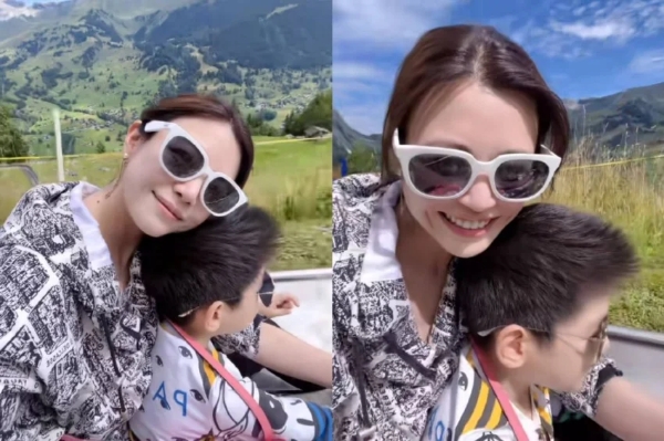陈妍希带儿子瑞士度假 靠在小星星头顶露出甜美梨涡